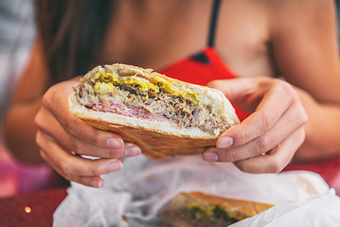 A stock photo of a zoomed in view of a Cuban sandwich.